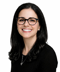 Cindy Lopez, Optimus Health Care staff member, smiling woman with glasses and dark hair